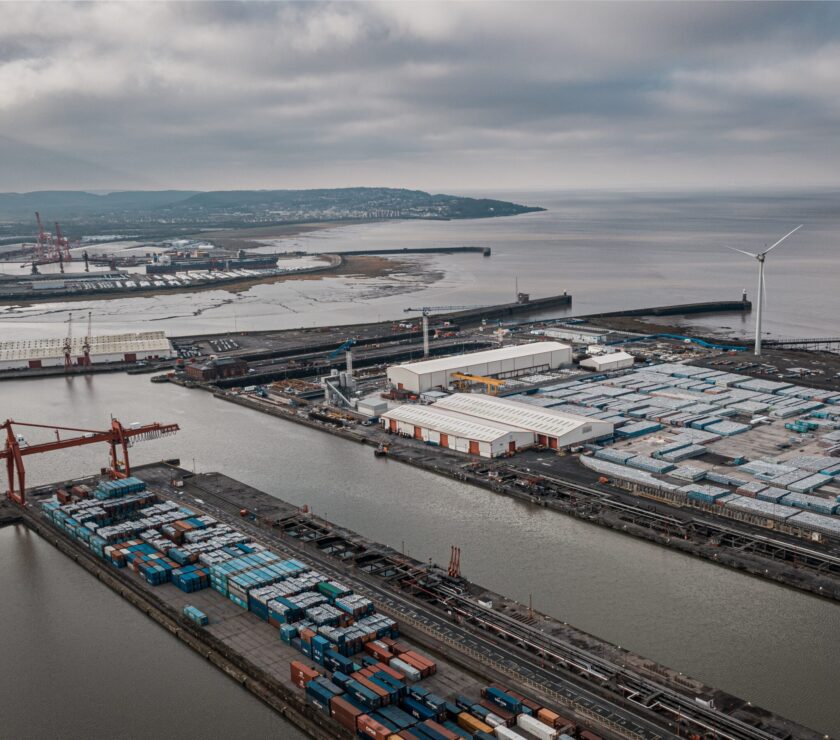 Aerial shot of industrial seaport under a cloudy sky